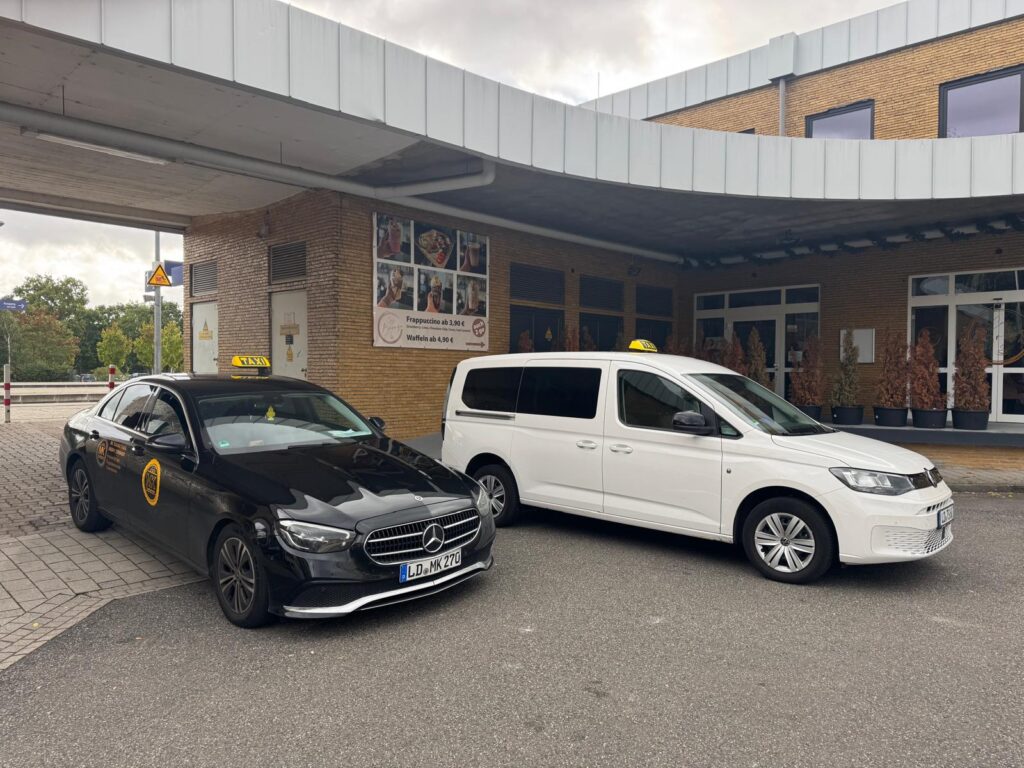 2 premium MK taxibetreib taxi in landau. one black BMW and other white group taxi