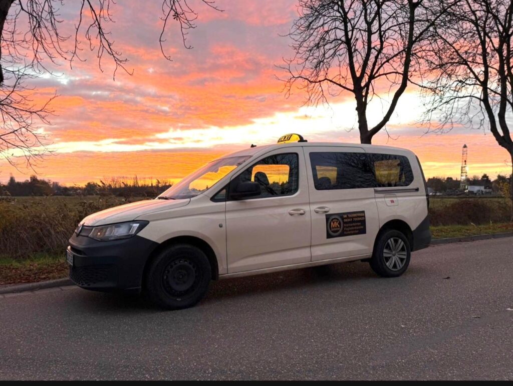 MK landau taxi on road outside main city Mktaxibetrieb